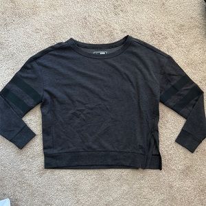 Dark gray crew neck with stripes on the arms